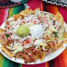 El Mariachi Mexican signature dishes Authentic Mexican BurritoMariachi NachosCarne Asada